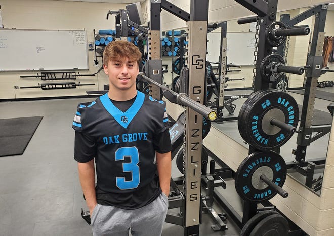 Oak Grove senior Chase Robertson wears his football jersey in the weight room, where the three-sport high school athlete spent many hours during his high school career. He's also a stand-out on the race track, having raced stock cars at Bowman Gray Stadium and other tracks since he was 14.