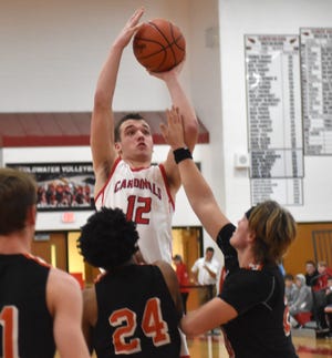 Coldwater's Zach Coffing rises above the Sturgis defense for two of his team high 10 points Tuesday night.