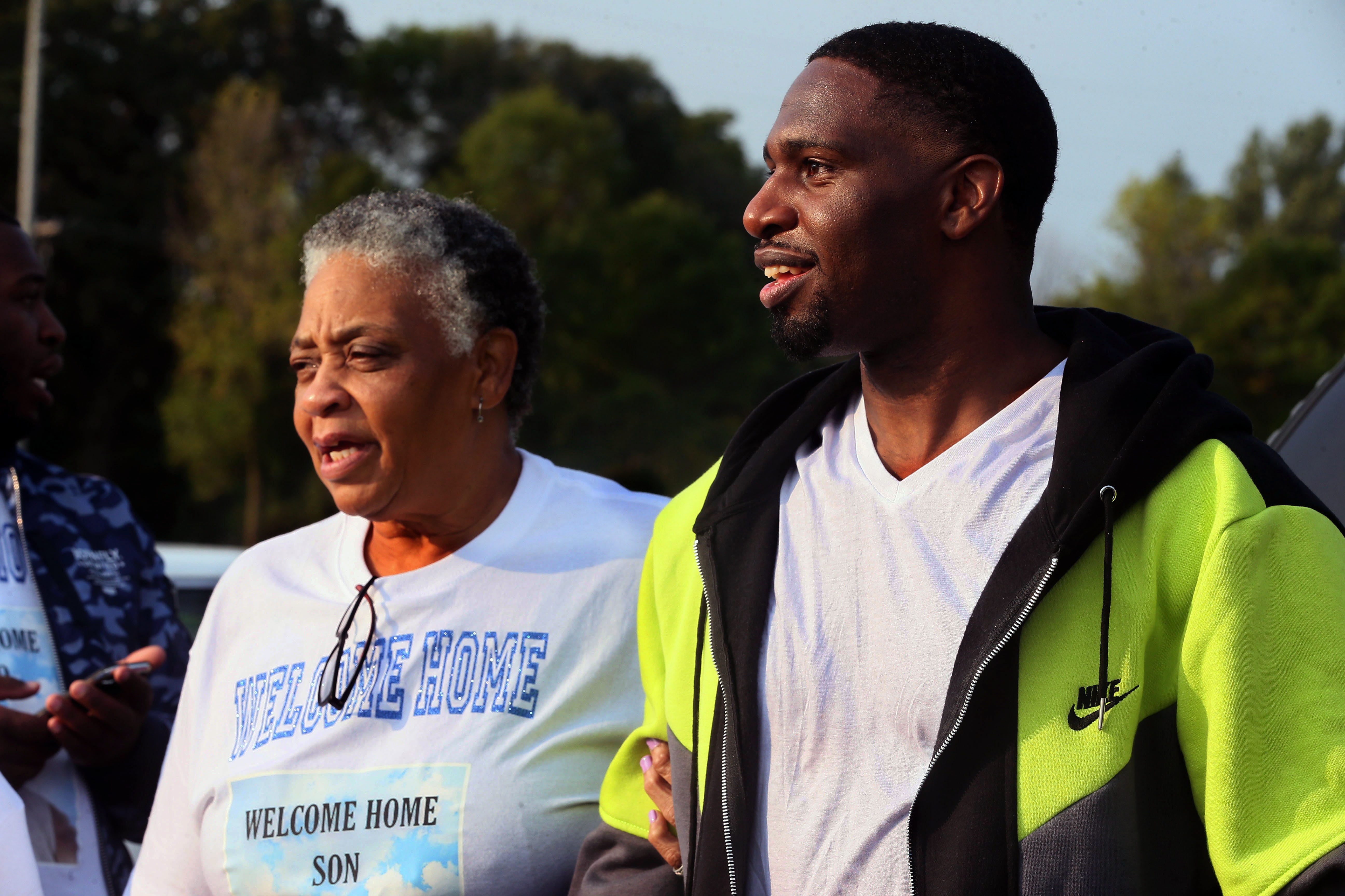 Doris Williams, 65, left, the mother of Marlin Dixon, right, welcomes him on his release from John C. Burke Correctional Center on Sept. 22, 2020.