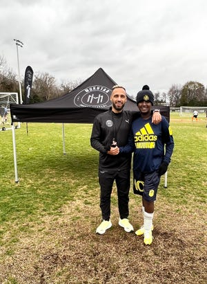 Nashville Soccer Club forward Hany Mukhtar (left) shakes hands with youth soccer camper Elijah Eatherly (right) at the inaugural Mukhtar Soccer Academy clinics at Lipscomb Academy.  Nov.  27, 2022.