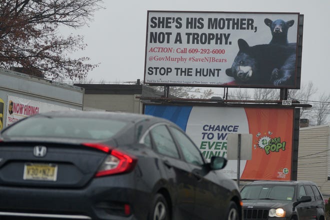 An anti-bear hunting billboard is seen on North Midland Avenue in Saddle Brook, New Jersey on Wednesday, December 7, 2022. 