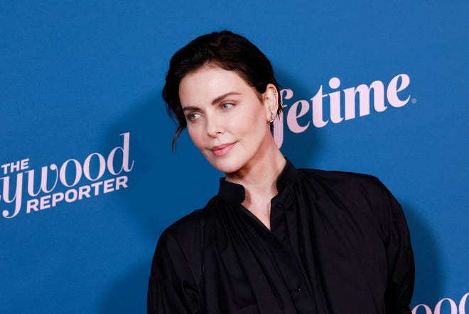 Charlize Theron accepted the Sherry Lansing Leadership Award at The Hollywood Reporter's annual Woman in Entertainment event presented by Lifetime on Dec. 7 in Los Angeles, California.