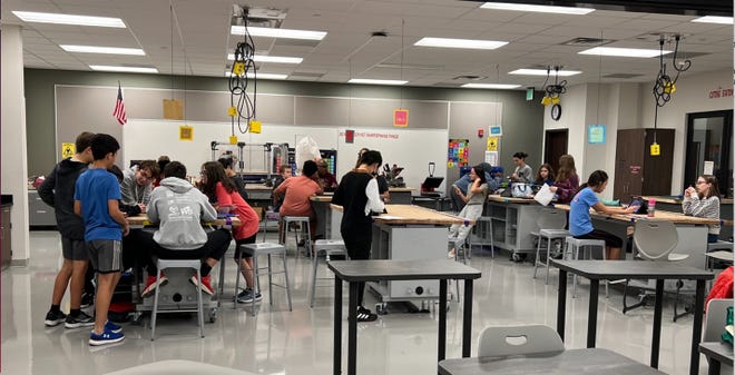 Tri-North Middle School’s Science Olympiad team talks before practice begins in the Tri-North Middle School science lab on Nov. 15, 2022.