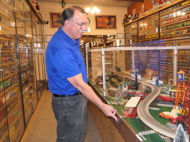 Toy Depot sales associate Joe Jackson demonstrates how the trin works at 127 S. Main St. in downtown Hutchinson.