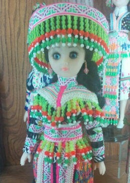 Close up of the three striped patterns on the sleeves of the author’s doll, representative of the traditional Hmoob Txaij Npab style.