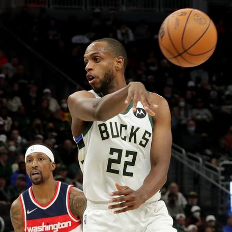 Milwaukee Bucks forward Khris Middleton (22) makes a no-look pass during the second half of their game against the Washington Wizards Tuesday, February 1, 2022 at Fiserv Forum in Milwaukee, Wis.