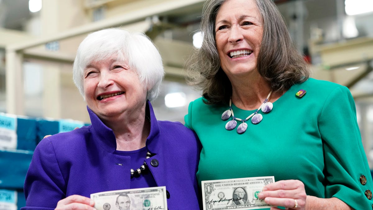 Secretary of the Treasury Janet Yellen, left, and Treasurer of the United States Chief Lynn Malerba show of money they autographed during a tour of the Bureau of Engraving and Printing's (BEP) Western Currency Facility in Fort Worth, Texas, Thursday, Dec. 8, 2022.