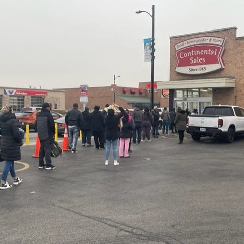 Shoppers line up, waiting for Continental Sales to