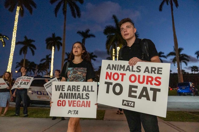 Protesters from PETA demonstrate outside the Palm Beach Bookstore during a book signing of "The Humane Table: Cooking with Compassion" by American Humane President and CEO Robin Ganzert earlier this month.