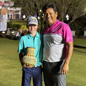 Fayetteville native Nate Horne, left, and Notah Begay III at Begay's junior golf championship in Louisiana. Horne won the 10-11 division.