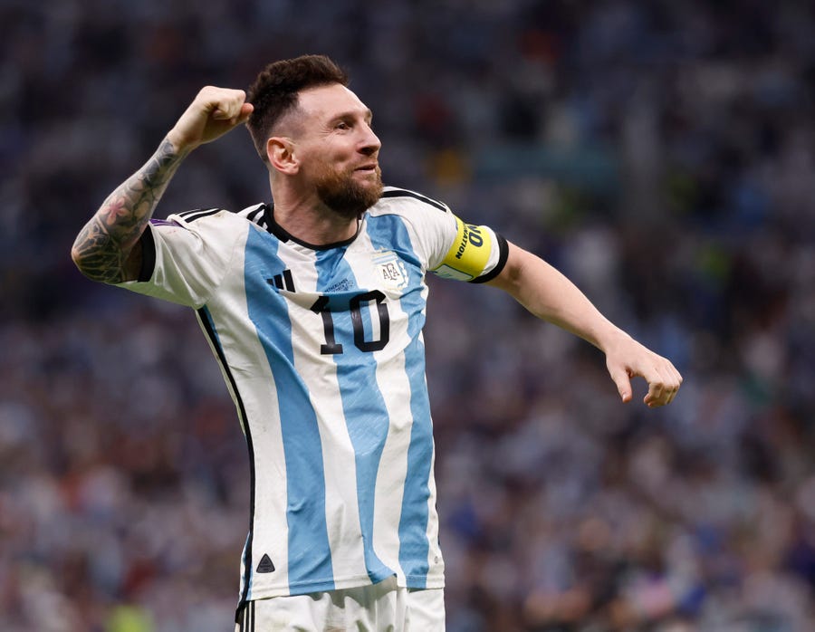 Argentina forward Lionel Messi celebrates after defeating Netherlands.
