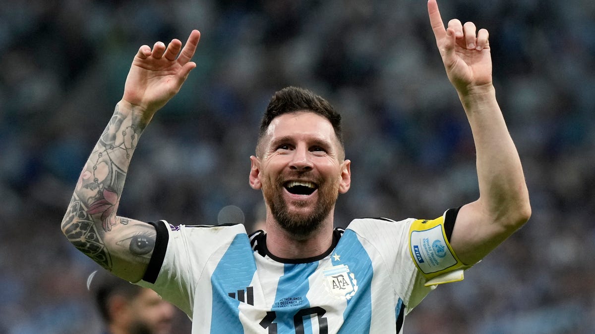 Argentina's Lionel Messi celebrates at the end of the World Cup quarterfinal soccer match between the Netherlands and Argentina, at the Lusail Stadium in Lusail, Qatar, Saturday, Dec. 10, 2022. Argentina defeated the Netherlands 4-3 in a penalty shootout after the match ended tied 2-2.