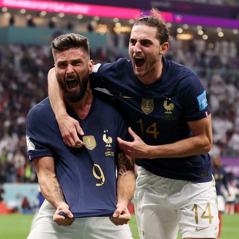 Olivier Giroud (left) celebrates after scoring the
