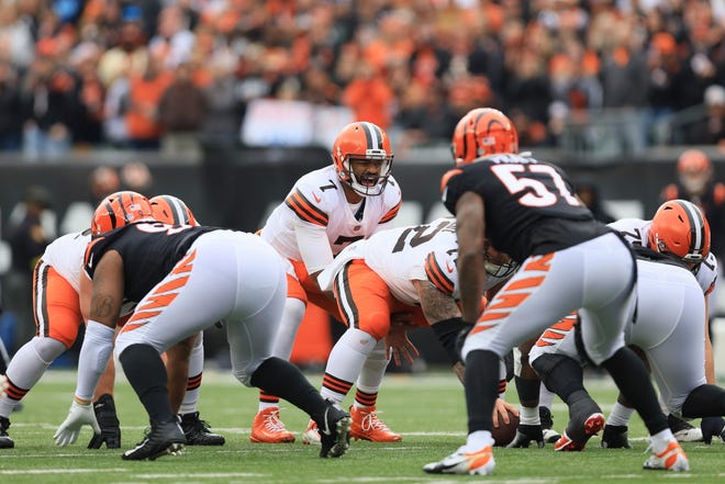 Cleveland Browns' Jacoby Brissett calls a play during the first half of an NFL football game against the Cincinnati Bengals, Sunday, Dec. 11, 2022, in Cincinnati. (AP Photo/Aaron Doster)