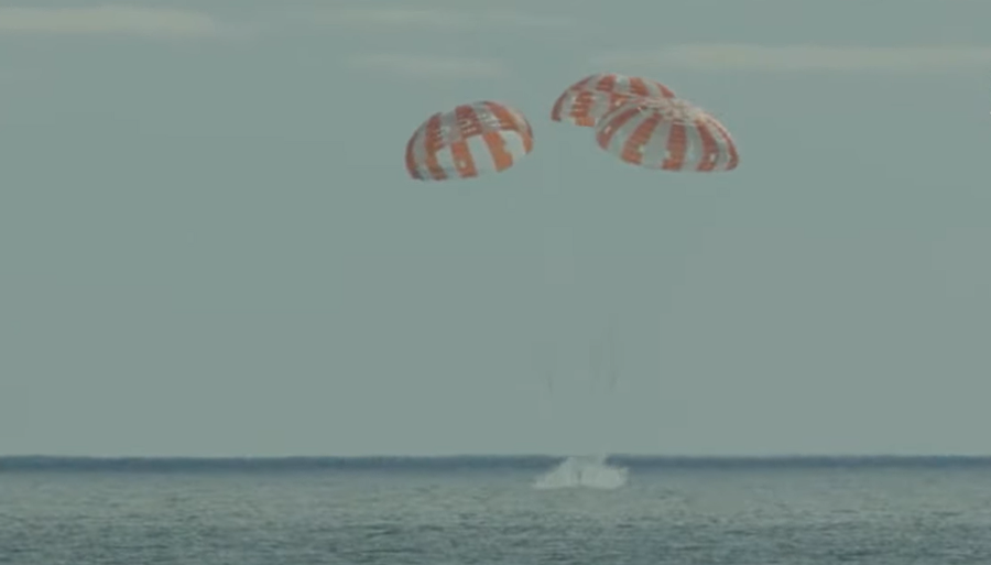 This screen capture from NASA's livestream on Sunday, Dec. 11, shows an uncrewed Orion capsule splashing down in the Pacific Ocean off the coast of California at 12:40 p.m. ET concluding the Artemis I mission to the moon and back.