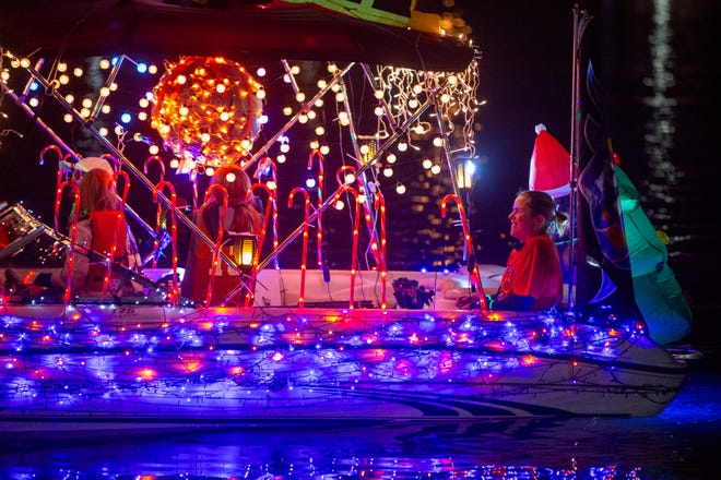 A parade boat sails in the Fantasy of Lights Boat Parade at Tempe Beach Park on Dec. 10, 2022.