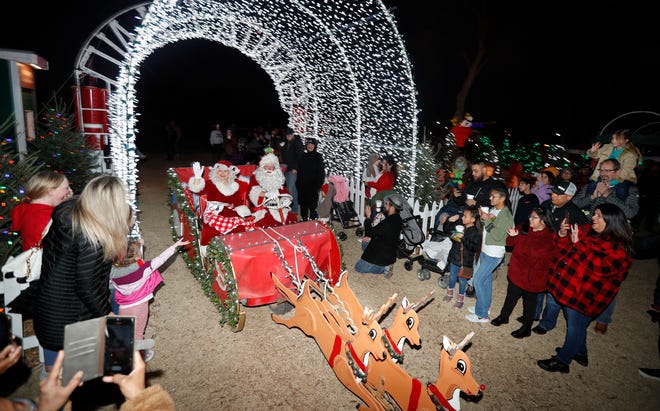 Mr. and Mrs. Claus arrive at Santa Land earlier this month. The City of Lubbock canceled the final night of the event Thursday due to frigid temperatures.