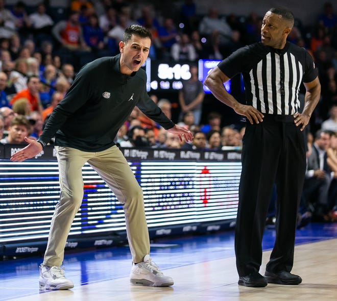 Florida Gators head coach Todd Golden goes off on an official after a call in the first half. The University of Florida menÕs basketball team hosted the University of Connecticut at Exactech Arena at the Stephen C. OÕConnell Center in Gainesville, FL on Wednesday, December 7, 2022. [Doug Engle/Gainesville Sun]