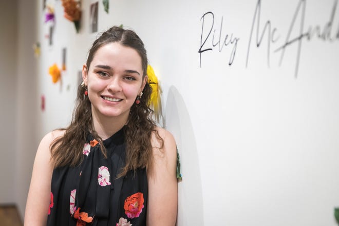 Riley McAndrews at her "I Hope the Flowers Were Worth It" exhibit in the Mariani Gallery at the University of Northern Colorado on December 8, 2022.