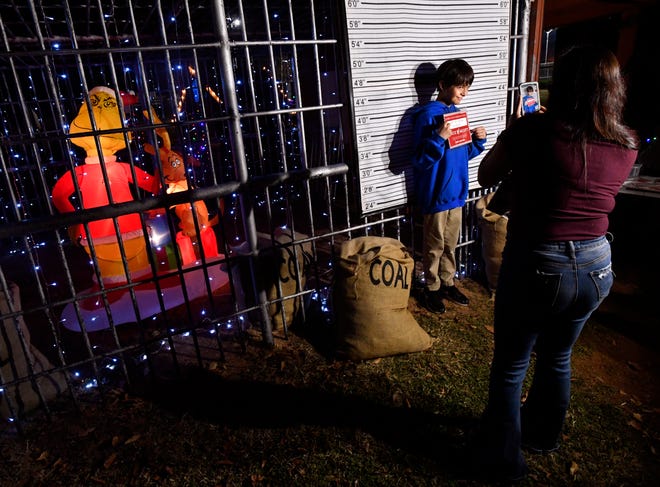Angie Moreno photographs her stepson Jayden, 11, outside the jail at Safety City on Thursday.