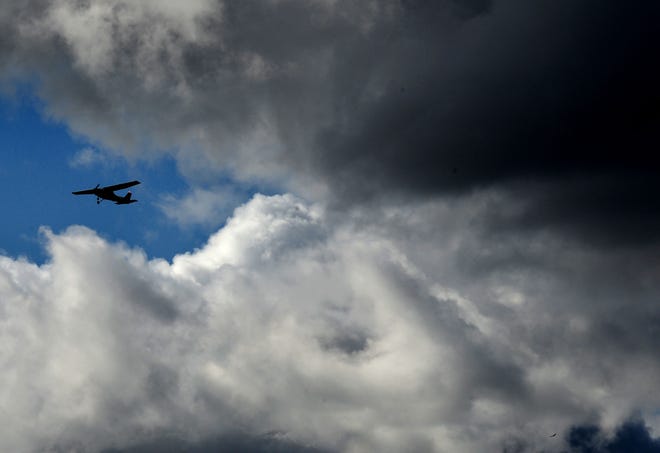 A plane flies through the clouds at Camarillo Airport on Monday, Dec. 12, 2022. A series of storms has drenched the area, including a record set Jan. 14, 2023 for the maximum in a one-day period at the airfield.
(Photo: JUAN CARLO/THE STAR)