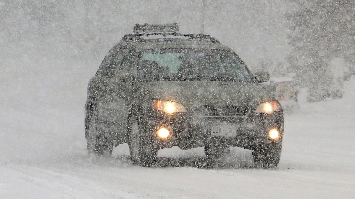 Cars slowly make their way as heavy snow falls on the Mt. Rose Highway near Reno, Nevada.