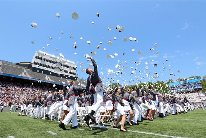 Graduating cadets toss their caps in the air at the end of the 2022 graduation and commissioning ceremony at the U.S. Military Academy at West Point.