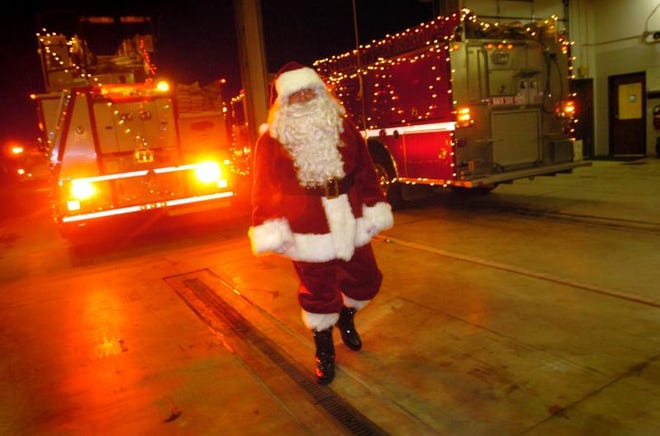Santa waits for his ride at the Berlin Township Volunteer Fire Department before a past Newport Holiday Parade. This year’s parade is tonight.