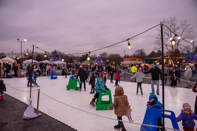 Attendees skate on a synthetic ice rink at the Bedford Blizzard Fest, hosted at Compelled Church in Temperance.