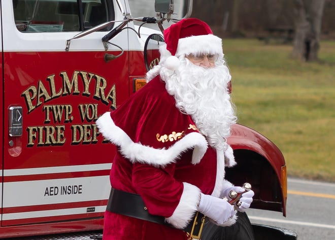 Santa Claus arrives on a fire truck in Palmyra Township for the fire department’s Breakfast with Santa.