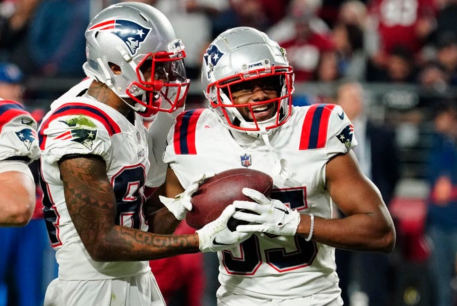 New England Patriots running back Pierre Strong Jr., right, celebrates after scoring a touchdown against the Arizona Cardinals during the second half of an NFL football game, Monday, Dec. 12, 2022, in Glendale, Ariz. (AP Photo/Darryl Webb)