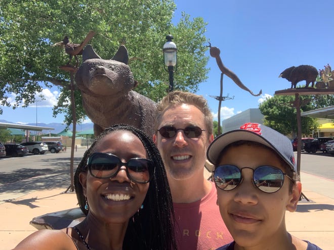 From left to right, Kate Matthews, Brennen Matthews and Thembi Matthews smile for a selfie at the Albuquerque, New Mexico Zoo. Brennen is the author of "Miles to Go: An African Family in Search of America Along Route 66." The book follows the family's travels along Route 66 in 2016.