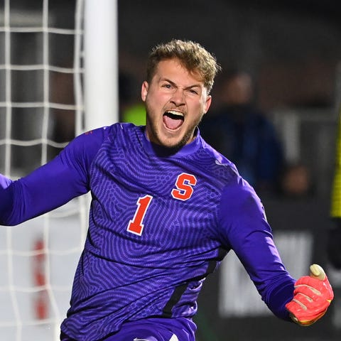 Syracuse goalkeeper Russell Shealy reacts after st