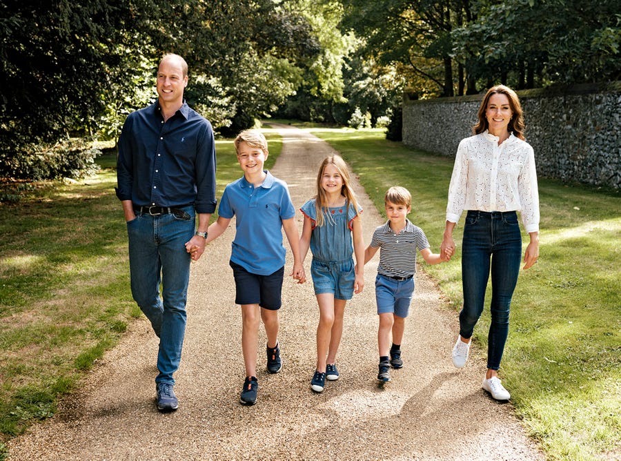 In this undated photo made available by Kensington Palace on Tuesday, Dec. 13, 2022, Britain's Prince William, left and Kate, Princess of Wales pose for a photo with their children, from second left, Prince George, Princess Charlotte and Prince Louis in Norfolk, England. The photo will feature on the family's Christmas card.