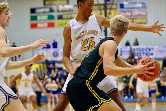 Hutchinsons Julian Smith (25) and Wade Meyer (13) play defense on the pass in a recent game at the Salthawk Activity Center.