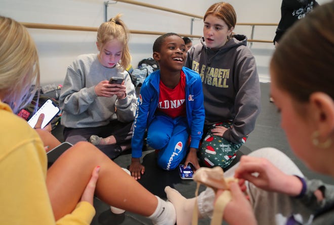 Lamar "LJ" Marshall, 8, waits with other dancers, including Sophia Wolff (left) and Julia Verton, (right) during rehearsal for The Nutcracker at the Wilmington Ballet, Tuesday, Dec. 13, 2022.