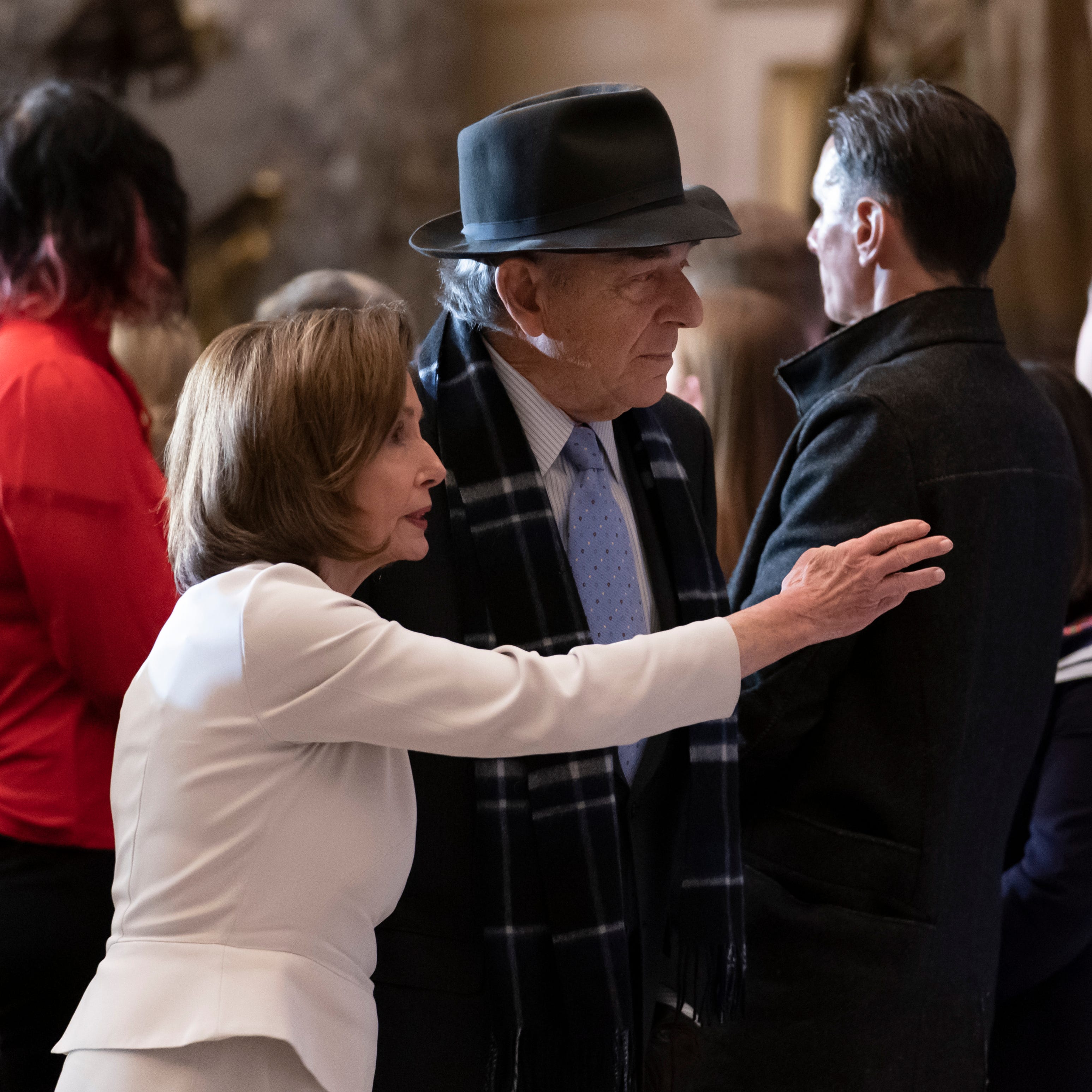 Speaker of the House Nancy Pelosi is joined by her husband Paul Pelosi on Wednesday as they attend her portrait unveiling ceremony in Statuary Hall at the Capitol in Washington.