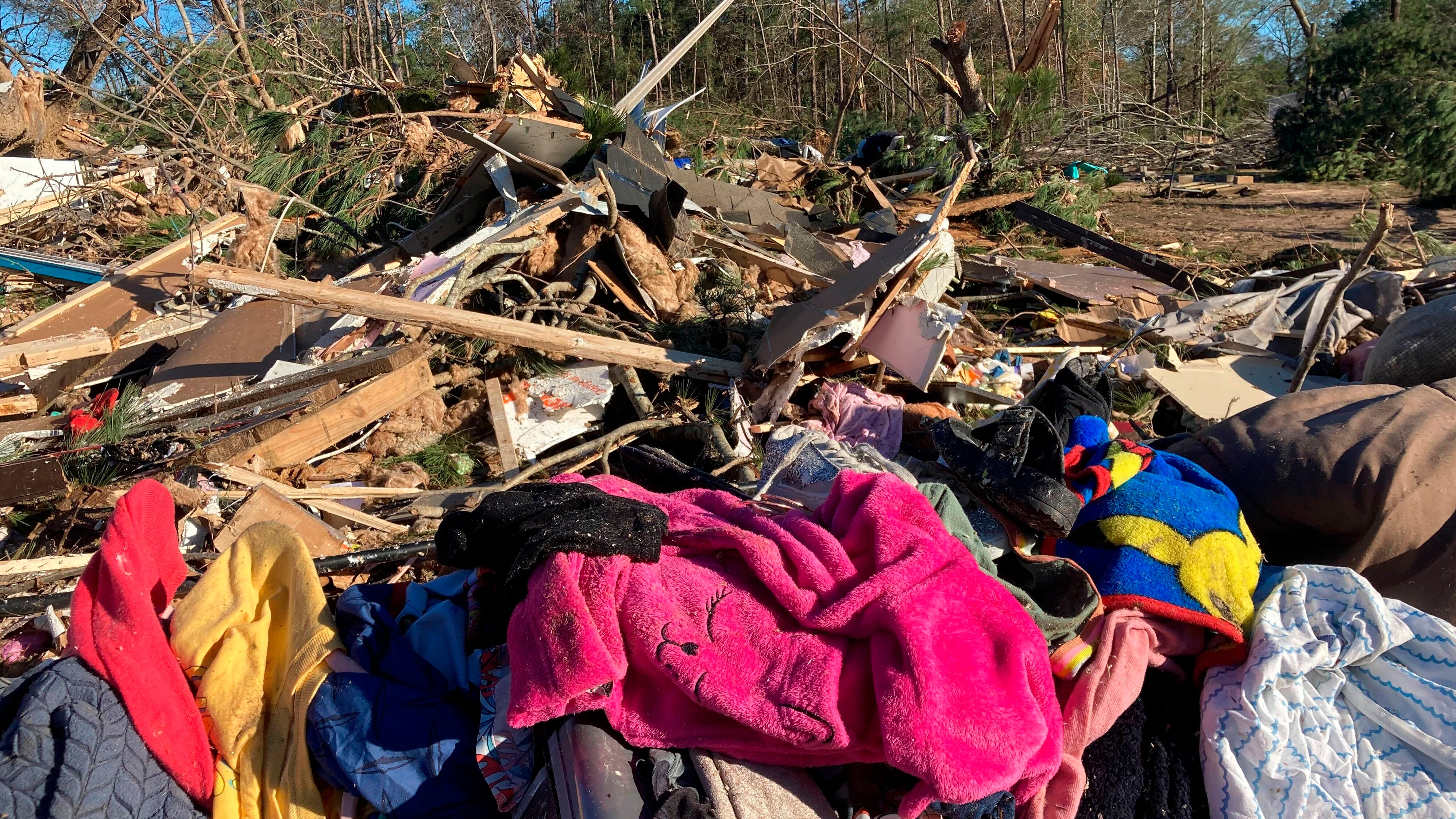 Debris is piled up following severe weather Wednesday, Dec. 14, 2022, in Keithville, La. A volatile storm ripping across the U.S. spawned tornadoes that killed a young boy and his mother in Keithville.