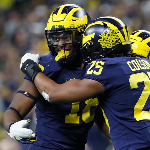 Michigan Wolverines linebacker Eyabi Okie (18) cel