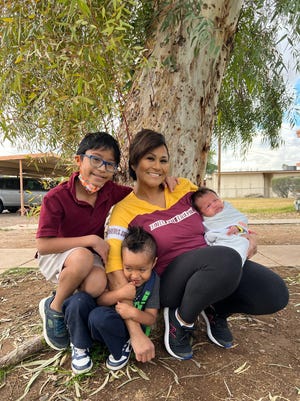 Karla Garcia with her three children in Tempe, Ariz.