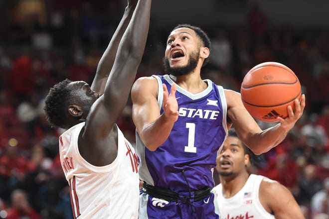Markquis Nowell (1) is one of just two Kansas State players and five from either team who are back from last year's game between the Wildcats and Nebraska. They meet again at 6 p.m. Saturday night at T-Mobile Center in Kansas City, Mo.