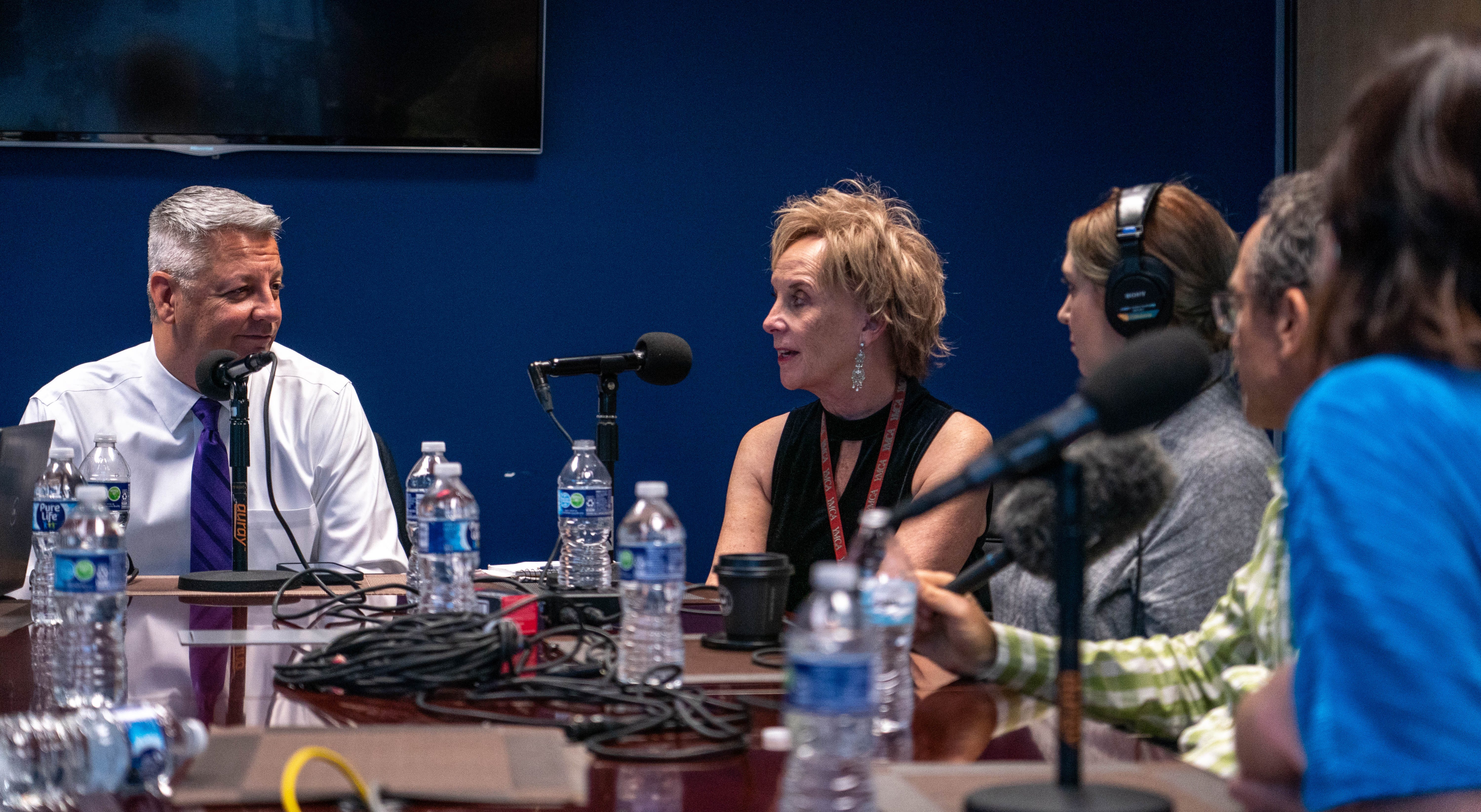 The Arizona Republic's Ronald J. Hansen, left, and Mary Jo Pitzl, middle, hosts of the Gaggle podcast, record an episode of the Gaggle with Republic reporters at the newsroom in Phoenix on Dec. 15, 2022.