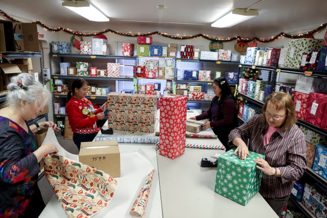 Staff and volunteers wrap presents for patients at Oregon State Hospital in Salem and Junction City.