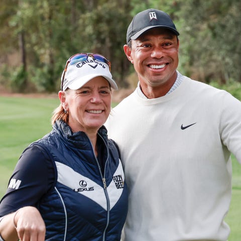 Annika Sorenstam, left, and Tiger Woods pose for a