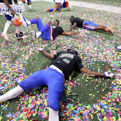 Florida Gators players celebrate after their win a