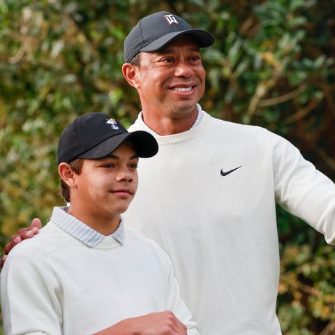 Tiger Woods and his son Charlie, left, get ready t