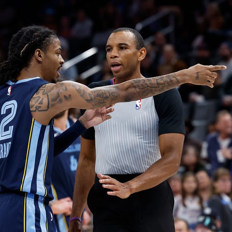 Memphis Grizzlies guard Ja Morant (12) points to f
