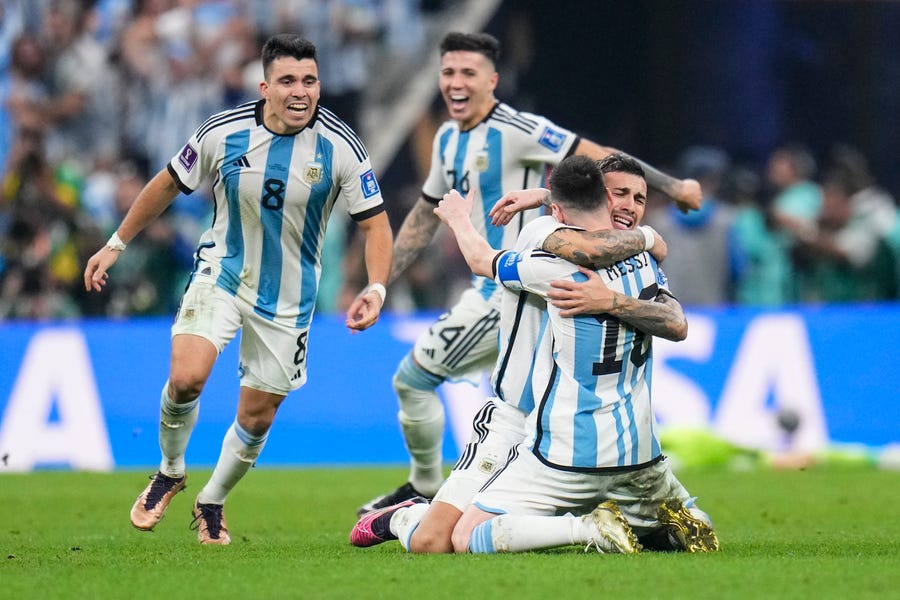 Argentina's players celebrate winning the World Cup final.