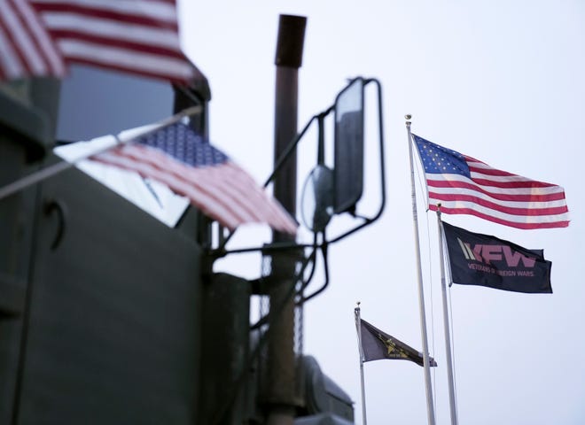 Dec 14, 2022; Hilliard, OH, U.S.; American flags fly outside the VFW Post 4931 in Hilliard on Wednesday. Mandatory Credit: Barbara J. Perenic/Columbus Dispatch
