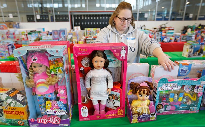 Volunteer Cassandra Beck of Quincy picks out some toys for a child.  This is her first year volunteering.